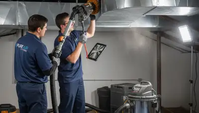 Technician cleaning air ducts in Charleston SC home for Five Star Cooling HVAC service